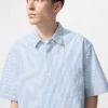 Camisas unisex de seersucker | Mangas cortas | A rayas Camisas unisex de seersucker | Mangas cortas | A rayas