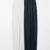 Pantalones anchos plisados de algodón y lyocell para mujer